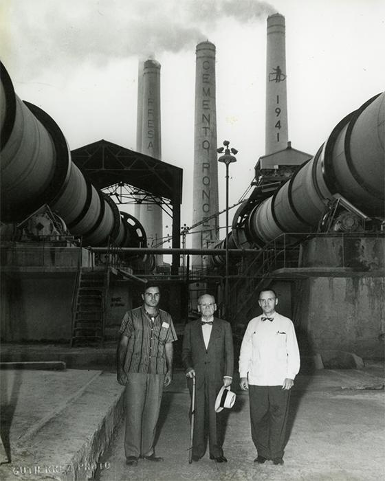 Antonio Ferré Bacallao and his sons Luis Alberto Ferré Aguayo and his grandson, Antonio Luis Ferré Ramírez de Arellano stand in front of the Cemento Ponce Factory established in 1941