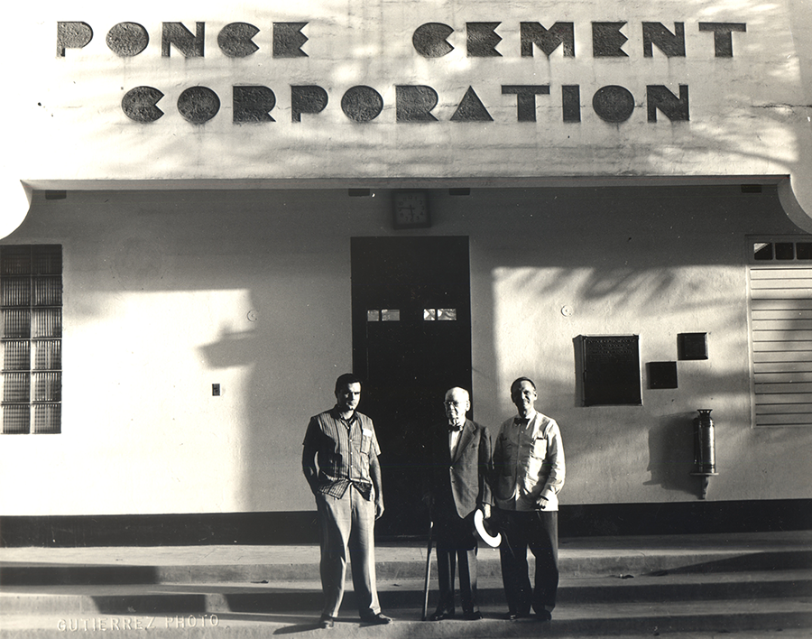 Antonio Ferré Bacallao and his sons Luis Alberto Ferré Aguayo and his grandson, Antonio Luis Ferré Ramírez de Arellano stand in front of the Cemento Ponce Offices established in 1941
